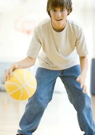 boy playing basketball