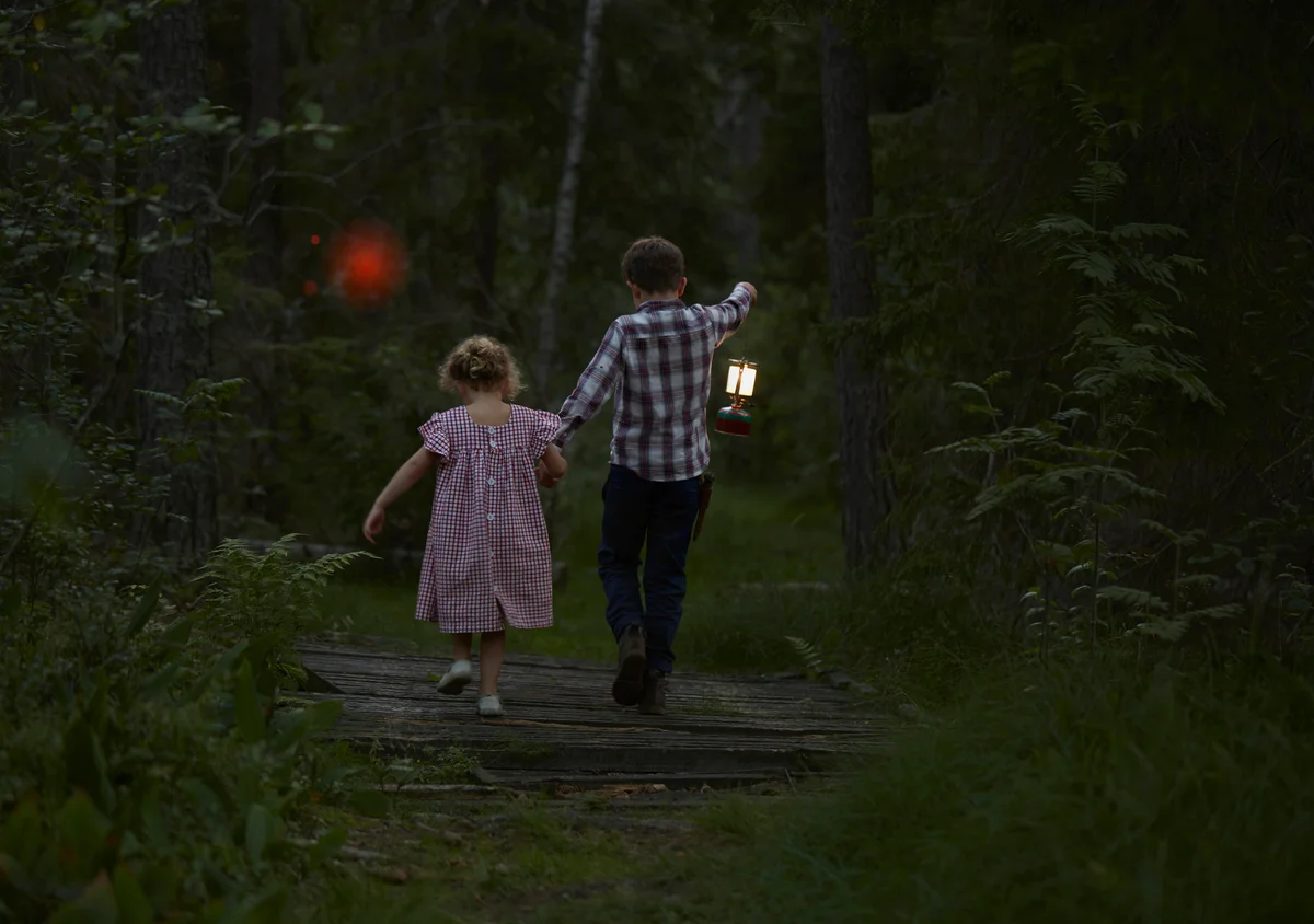 kids entering forest with red orb