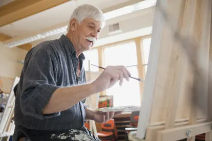 Man painting in art class