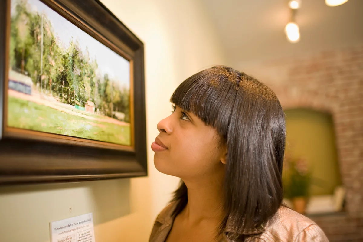 admiring painting in gallery