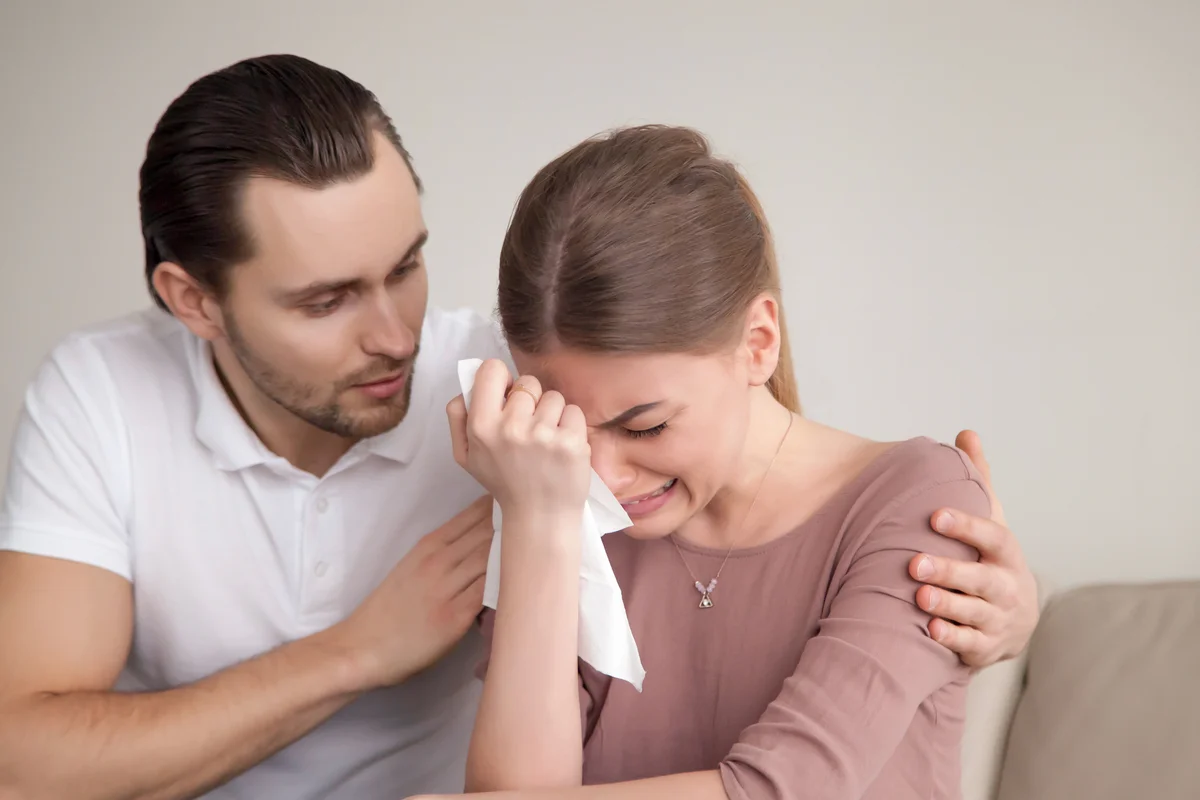 Husband comforting wife
