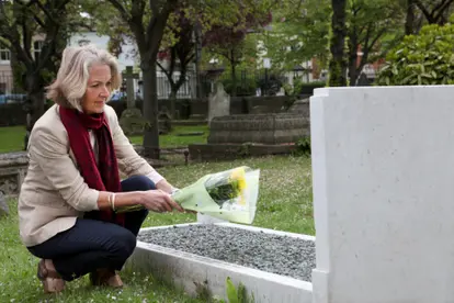 flowers at grave stone