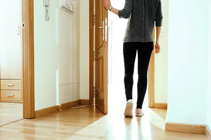 woman opening door