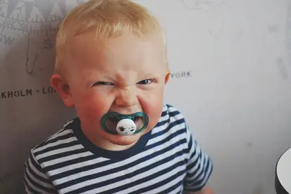 baby clenching pacifier