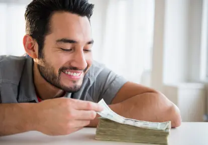man counting money