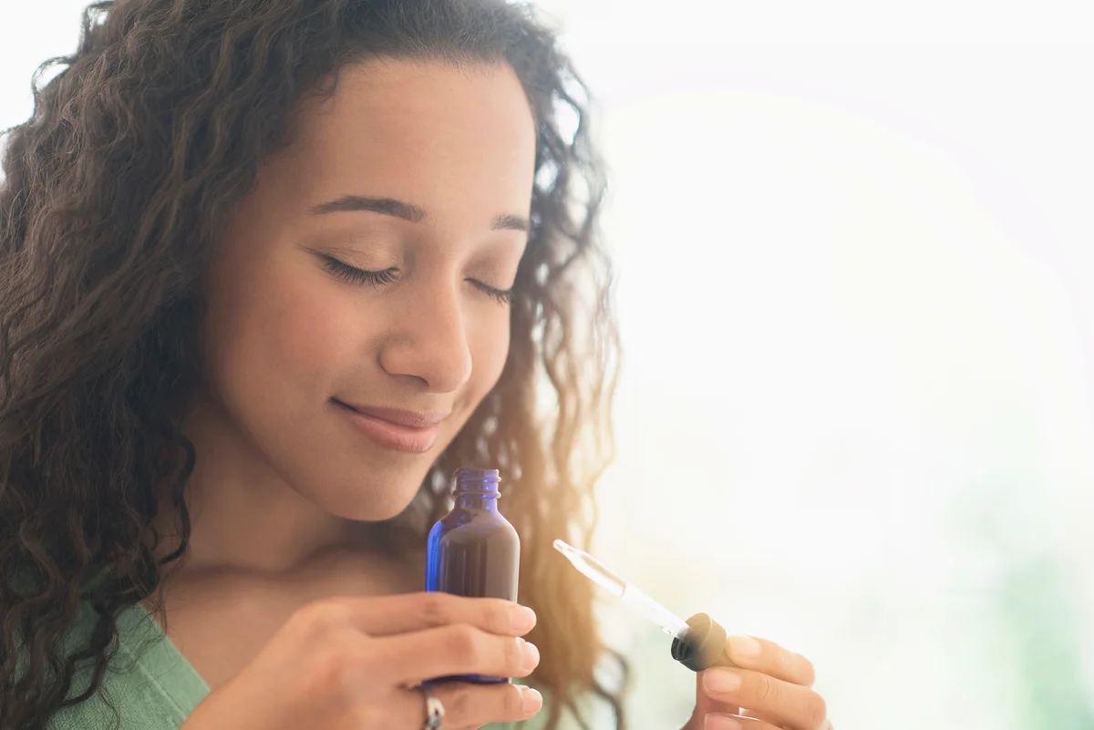 smelling aromatherapy oil
