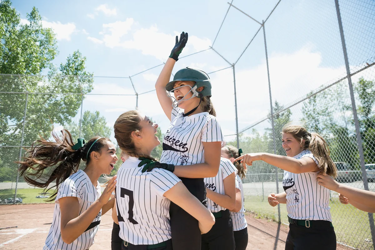 Girl softball team celebratin