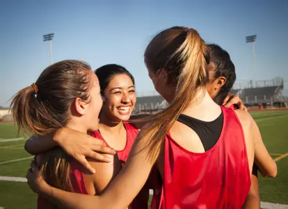 Team of runners celebrating