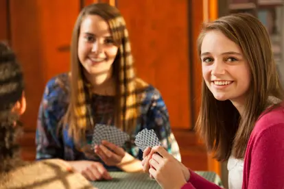 Young Women Playing Cards