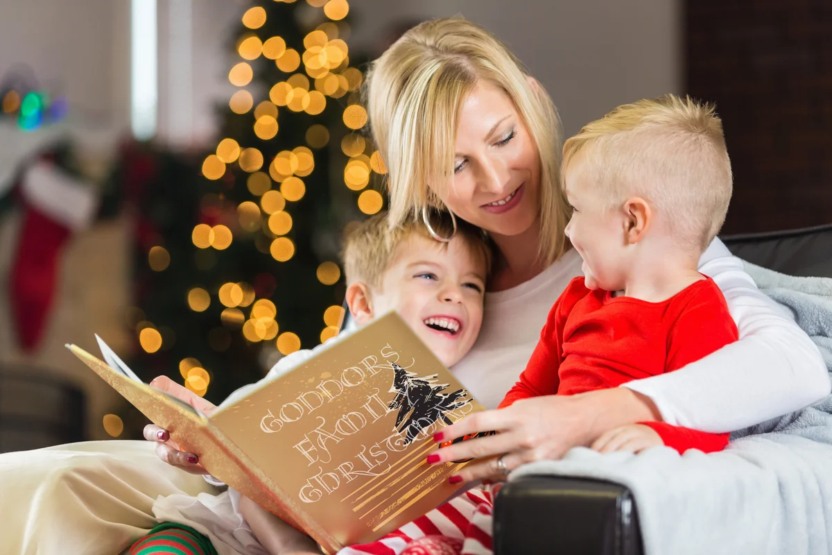 Family looking at Christmas memory book