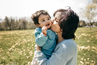 Mom kissing baby boy