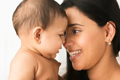 mother playing with baby