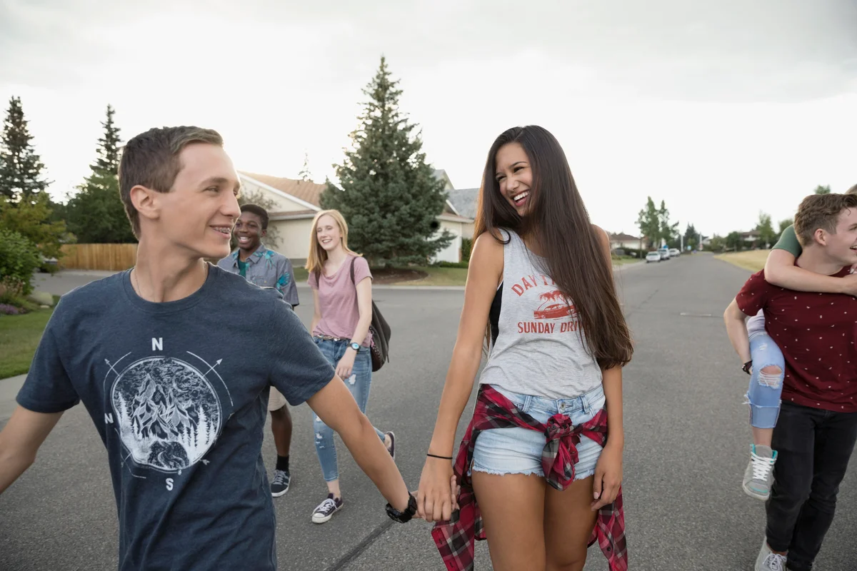 Teenage couples walking on street