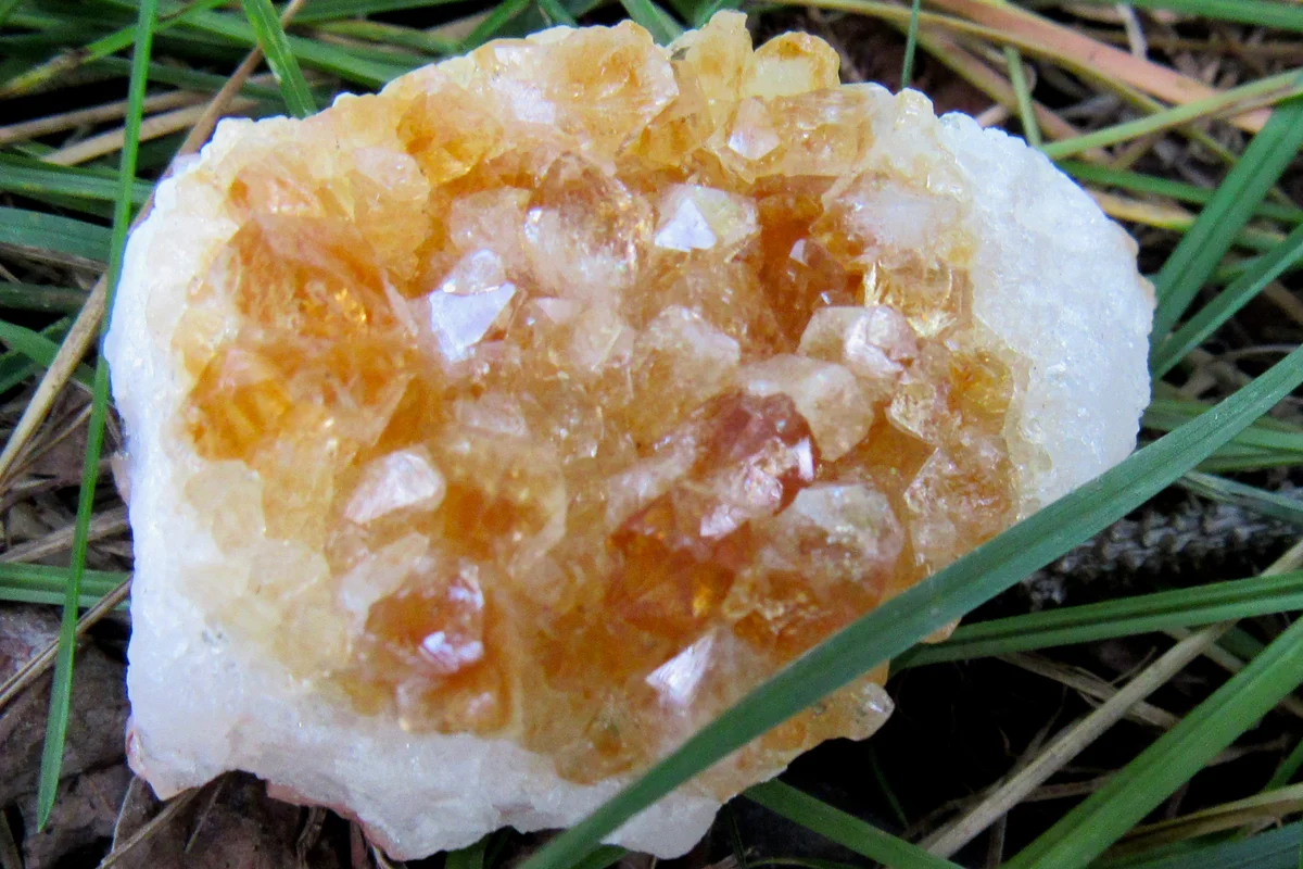 Citrine crystal on grass