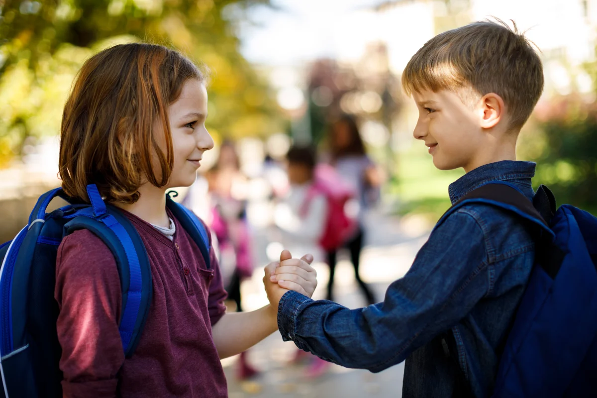 young kids saying hello