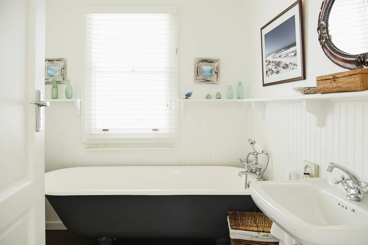 bathroom with aqua glass on display