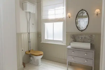 simple country bathroom with antique mirror