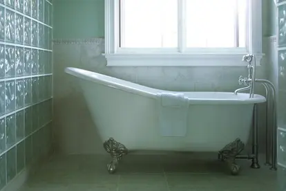 clawfoot tub in simple bathroom