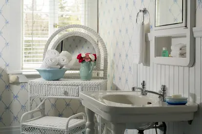 wicker vanity in white bathroom