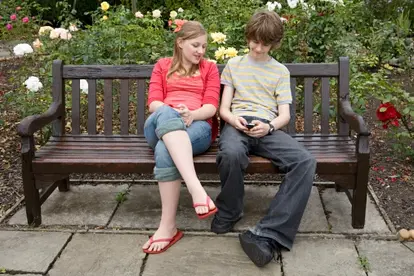 Girl and boy with cell phone