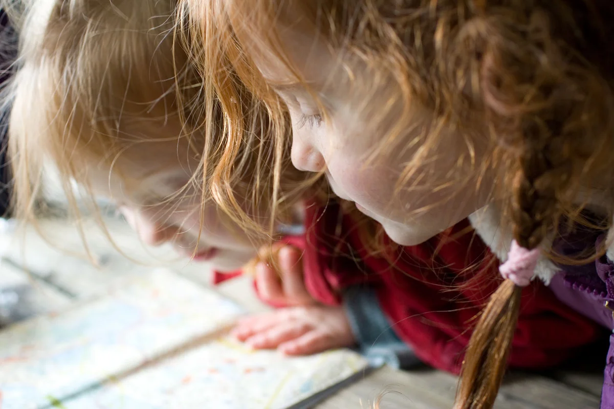 two girls looking at map