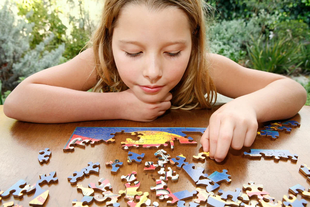 Girl doing puzzle
