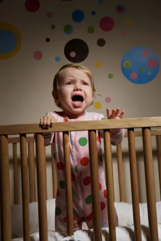 10 month old baby in crib crying
