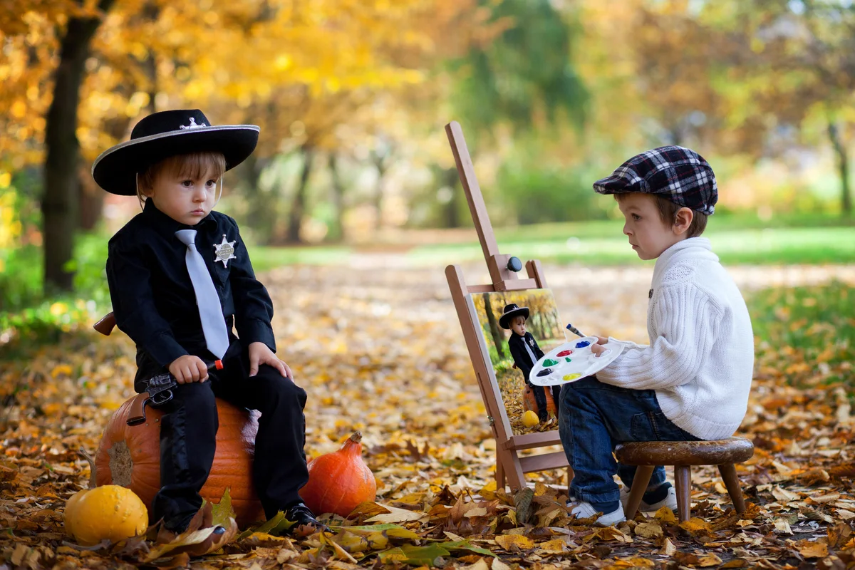 Two toddler boys in Halloween costumes