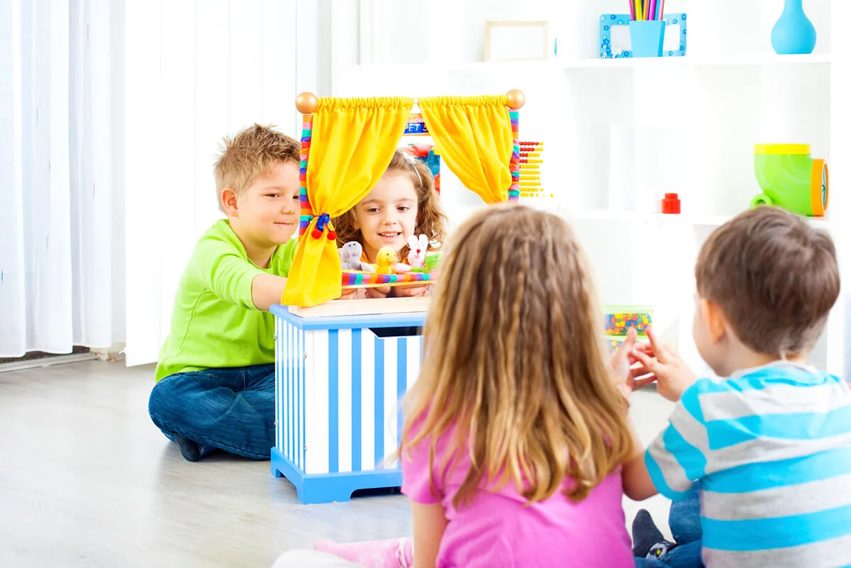Children playing puppet show