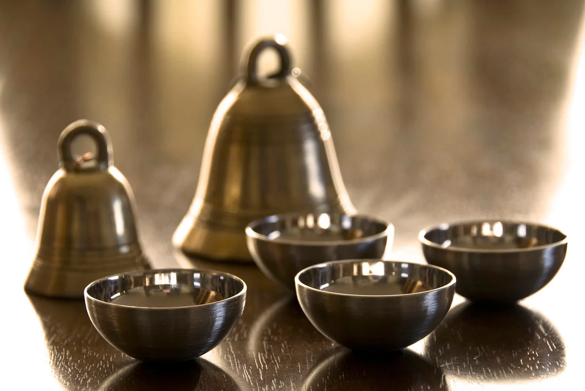 Brass bells and silver bowls