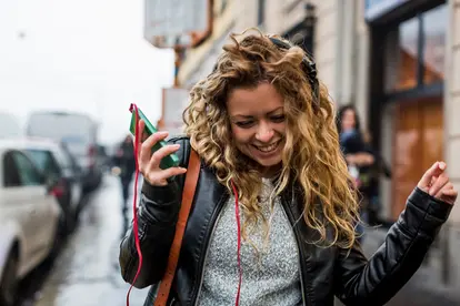 Woman listening to music on headphones