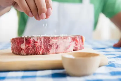 seasoning steak with salt