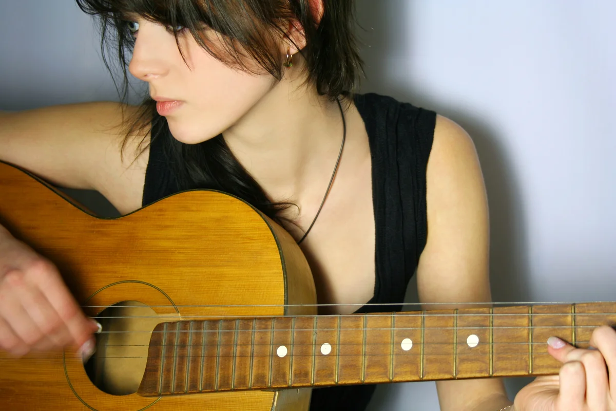 girl playing guitar