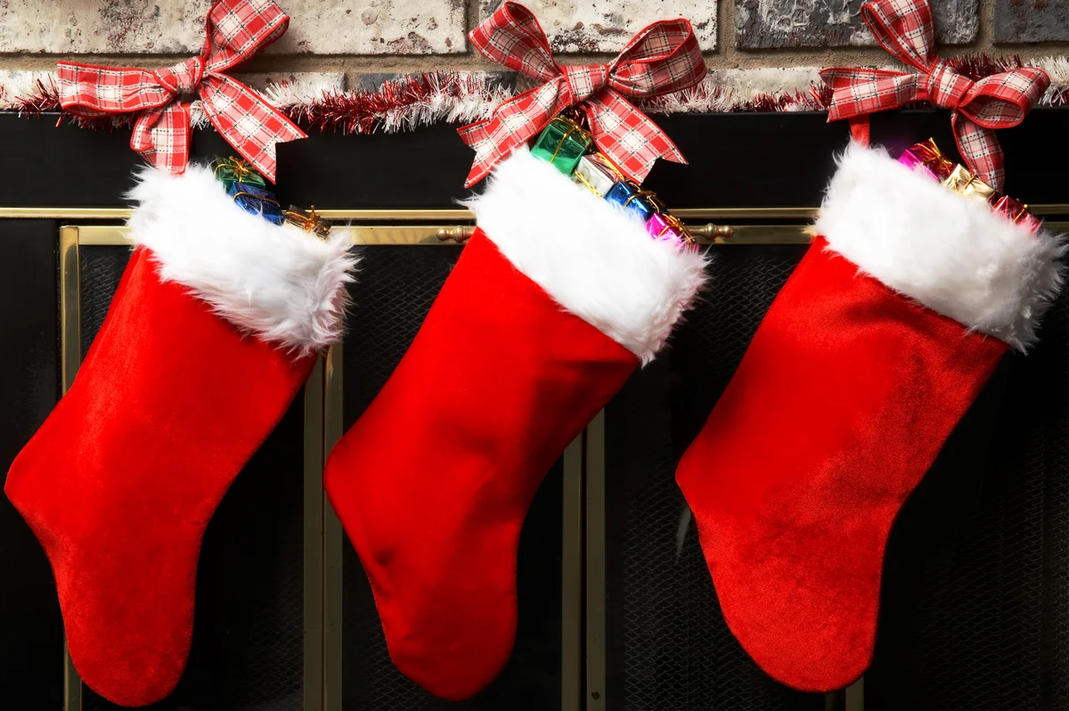 Christmas stockings hanging on a fireplace