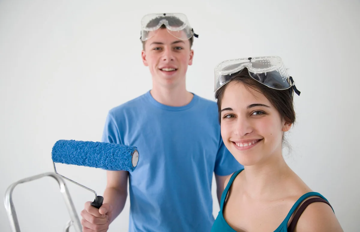 Two teenagers decorating