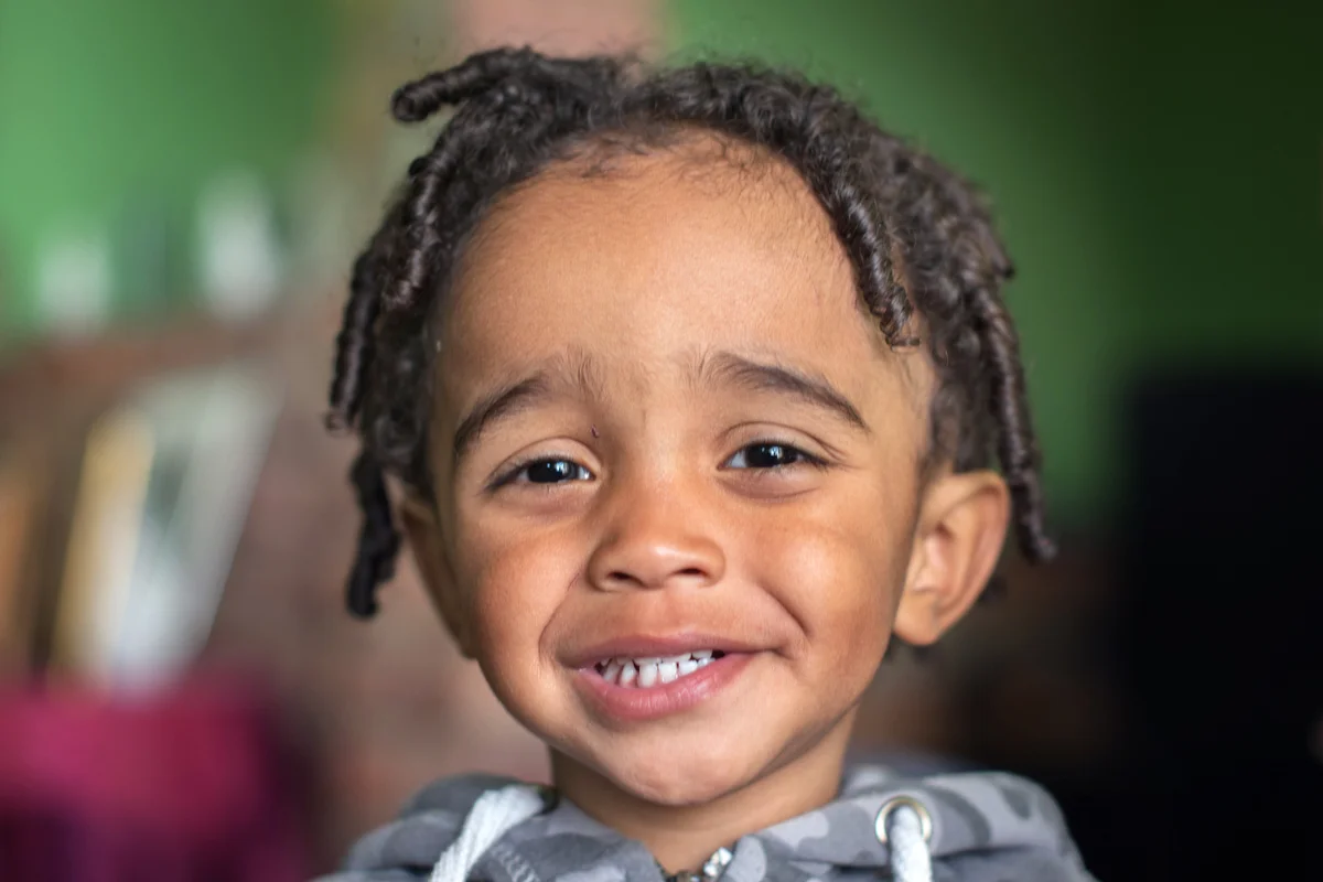 Smiling Boy with curly haircut