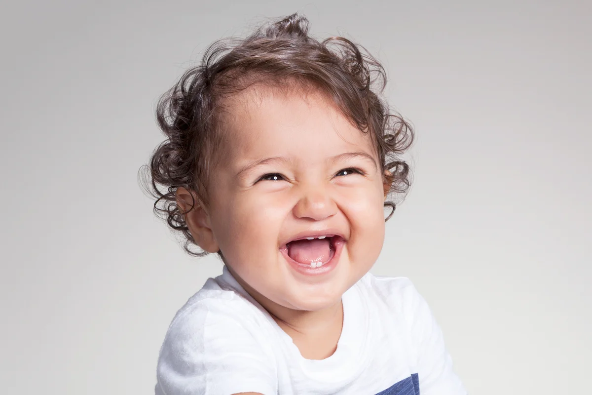 Baby with curly top hair