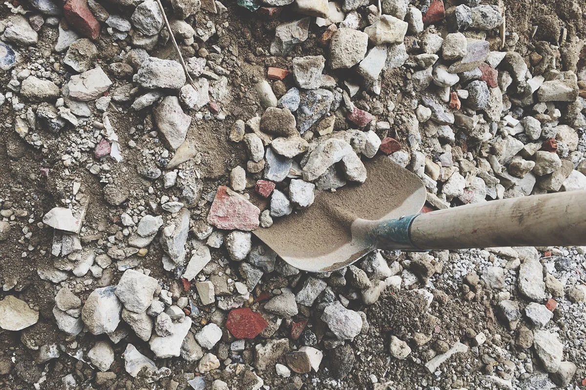 High Angle View Of Shovel By Rubble