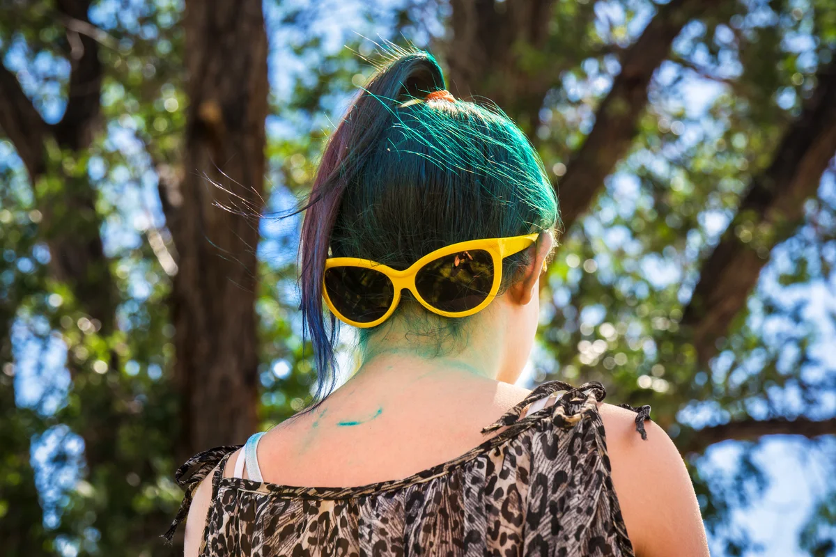 Girl with dyed hair and stained neck