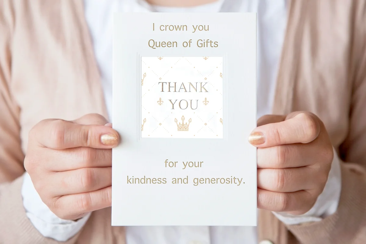 Woman holding a thank you card