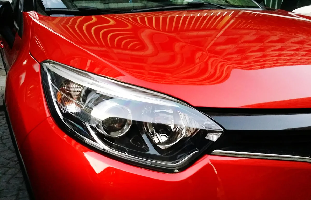 Close-Up Of Red Car Headlight