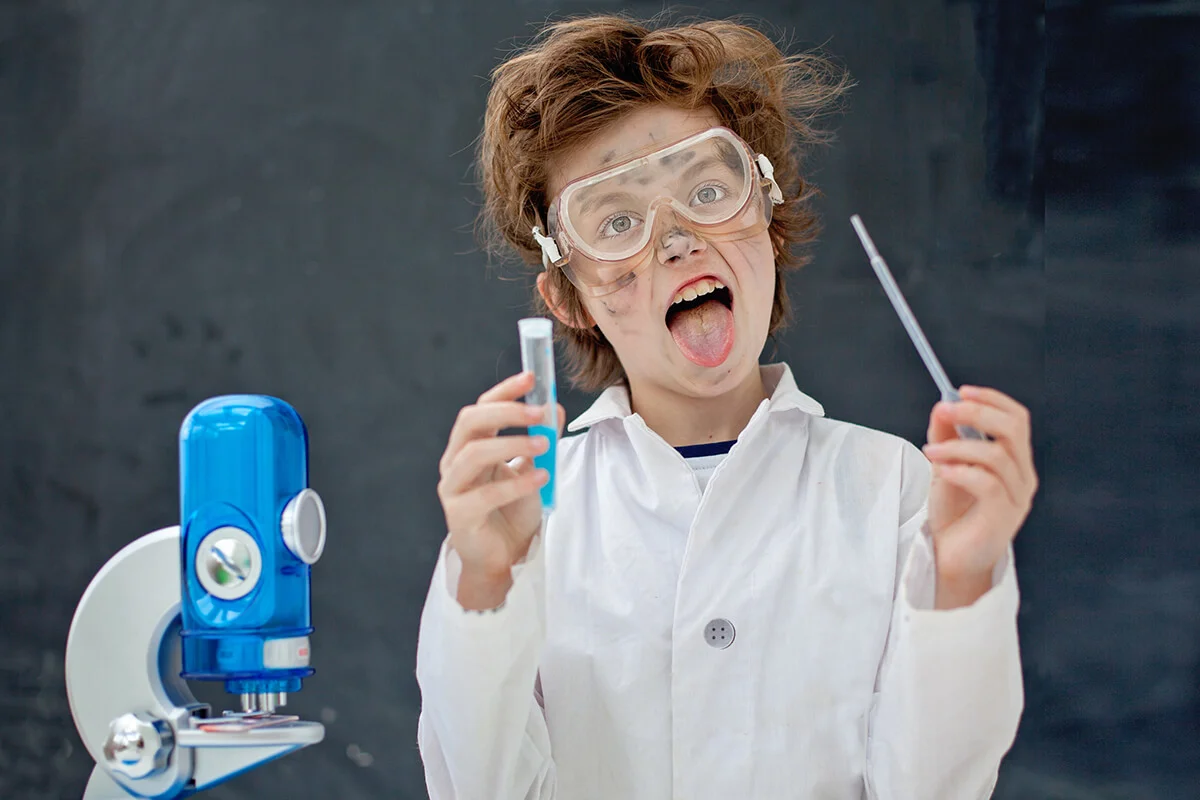 boy making some scientific experiments at class