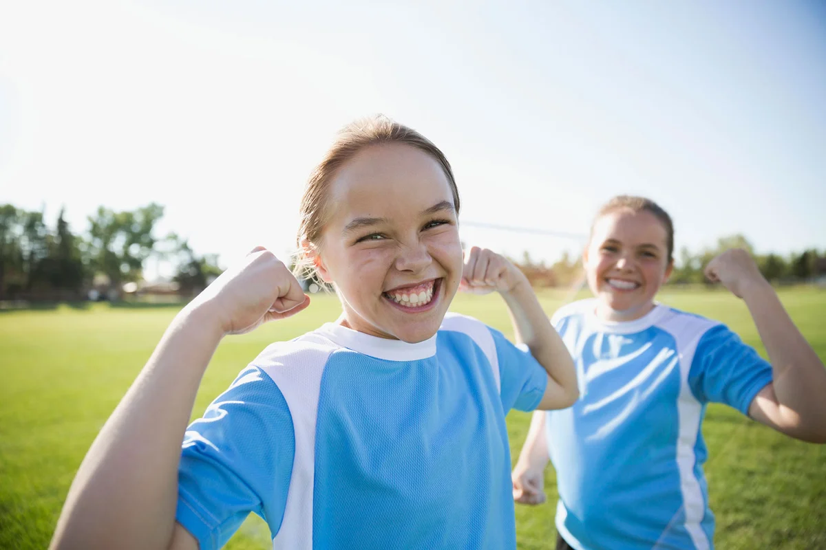 Girls flexing muscles