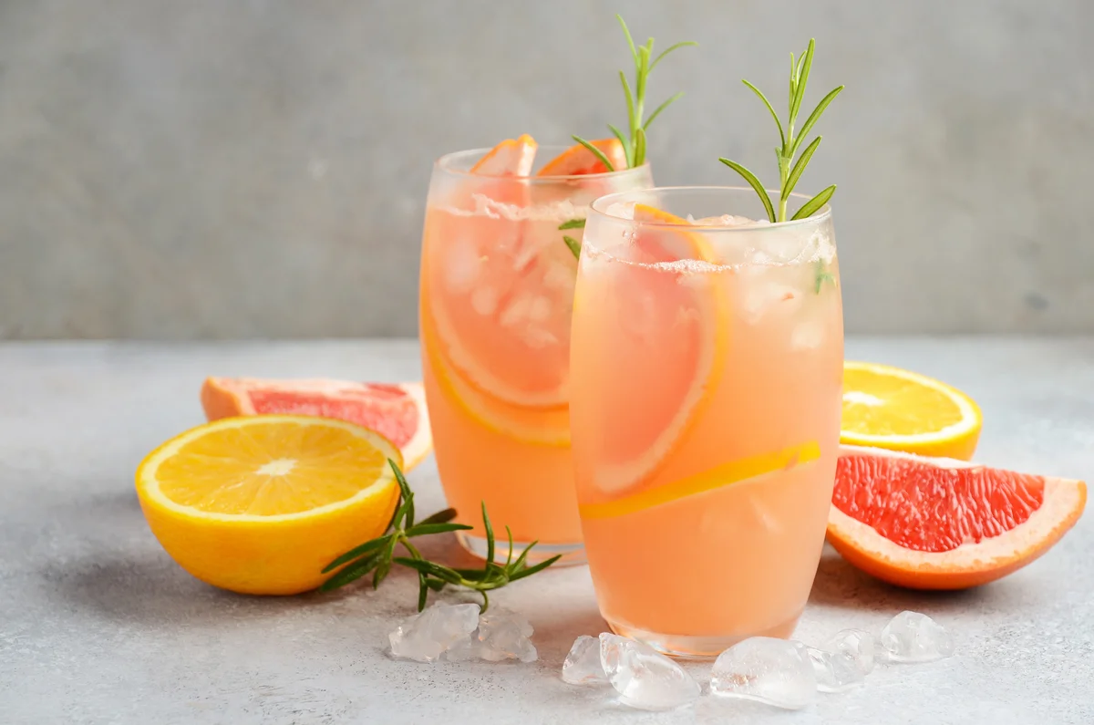 Refreshing citrus cocktail with grapefruit, orange and rosemary