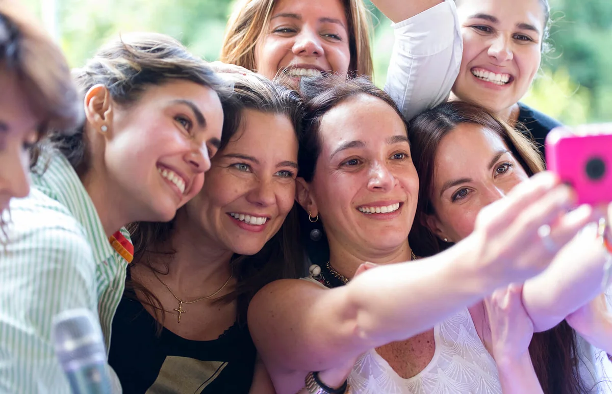 Women taking selfie at family reunion