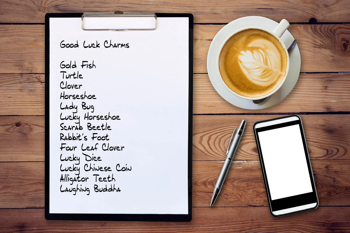 Good luck charms list on clipboard