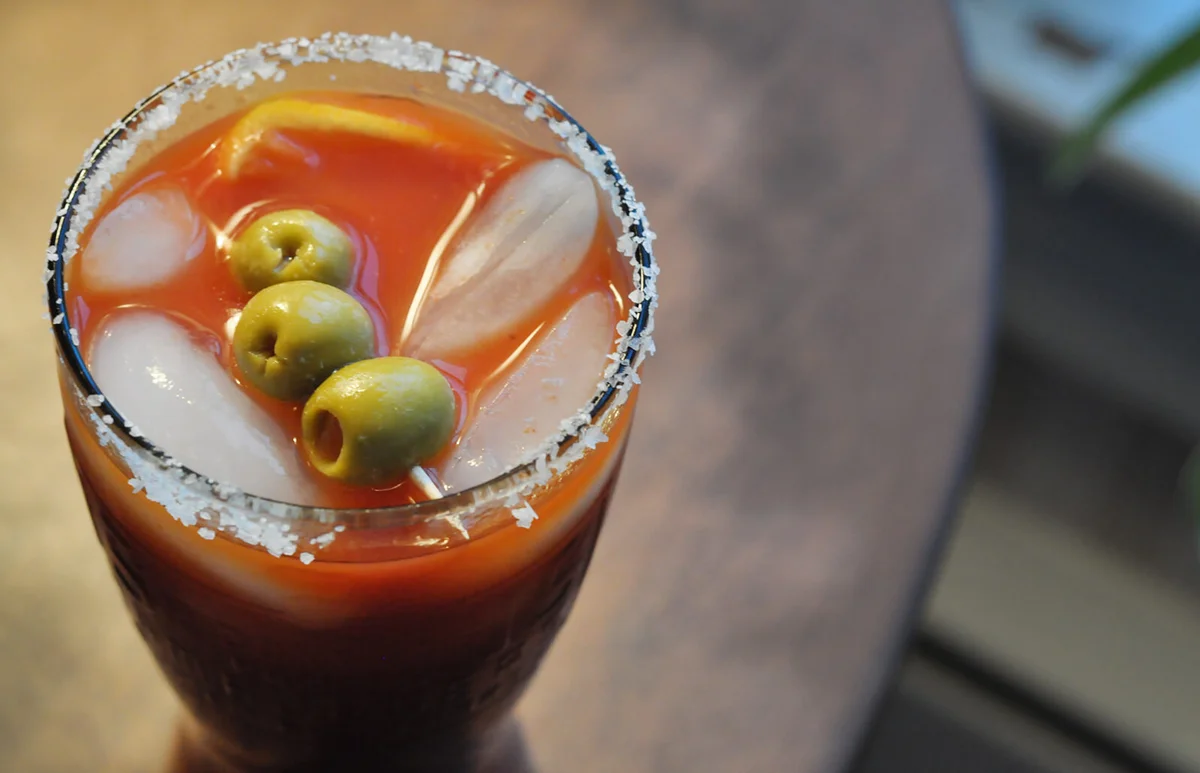 Bloody Mary Drink with a Salt-rimmed Glass and Olives