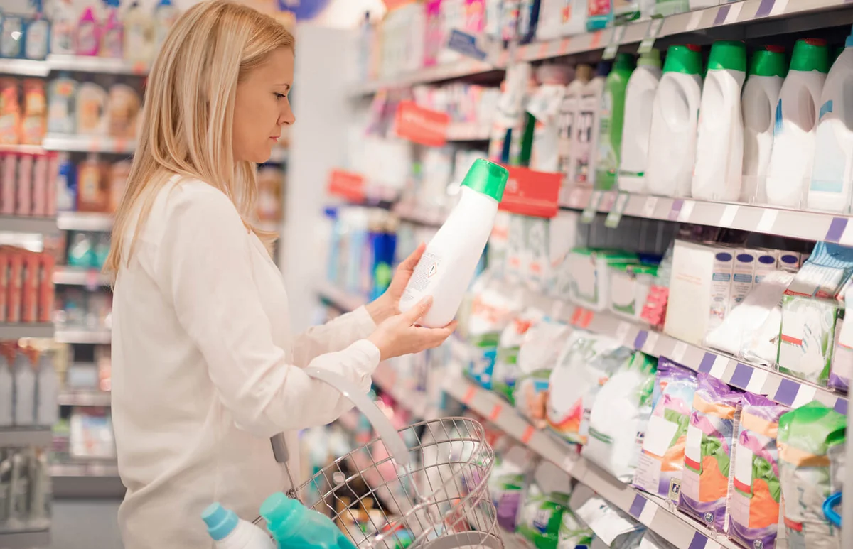 Woman choosing laundry detergent