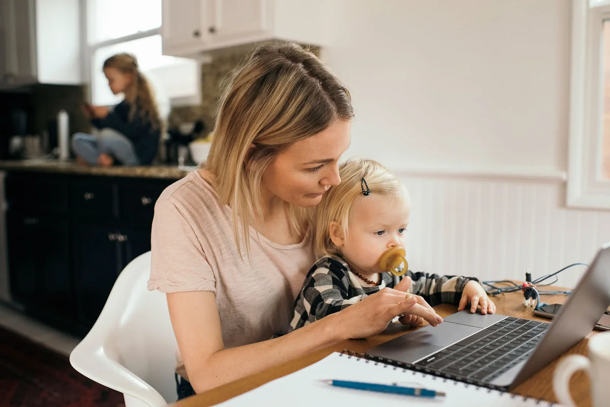 Mother and daughter using laptop computer
