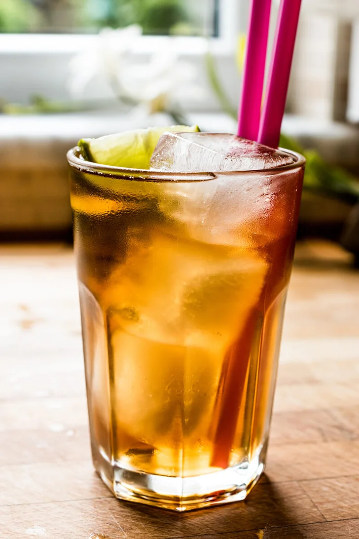 Long island iced tea cocktail with lime